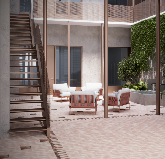 The common area: an open steel stair, terracotta paving, four armchairs around a low table, a green wall.
